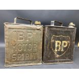 Two early versions of a BP two gallon petrol can, one with shield shaped transfer.