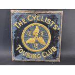 A Cyclists' Touring Club embossed brass sign, attached to a board, 16 1/2 x 17".