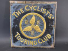A Cyclists' Touring Club embossed brass sign, attached to a board, 16 1/2 x 17".
