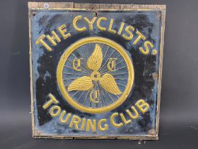 A Cyclists' Touring Club embossed brass sign, attached to a board, 16 1/2 x 17".