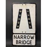 A metal road sign for Narrow Bridge with integral glass reflectors, 12 x 21".