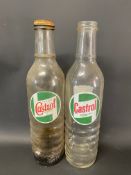 Two Castrol quart glass oil bottles.