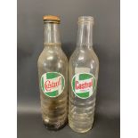 Two Castrol quart glass oil bottles.