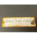 A small Vigzol Oils 'Shut this gate' enamel sign, 7 1/2 x 2 1/2".