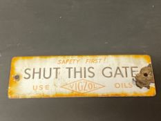 A small Vigzol Oils 'Shut this gate' enamel sign, 7 1/2 x 2 1/2