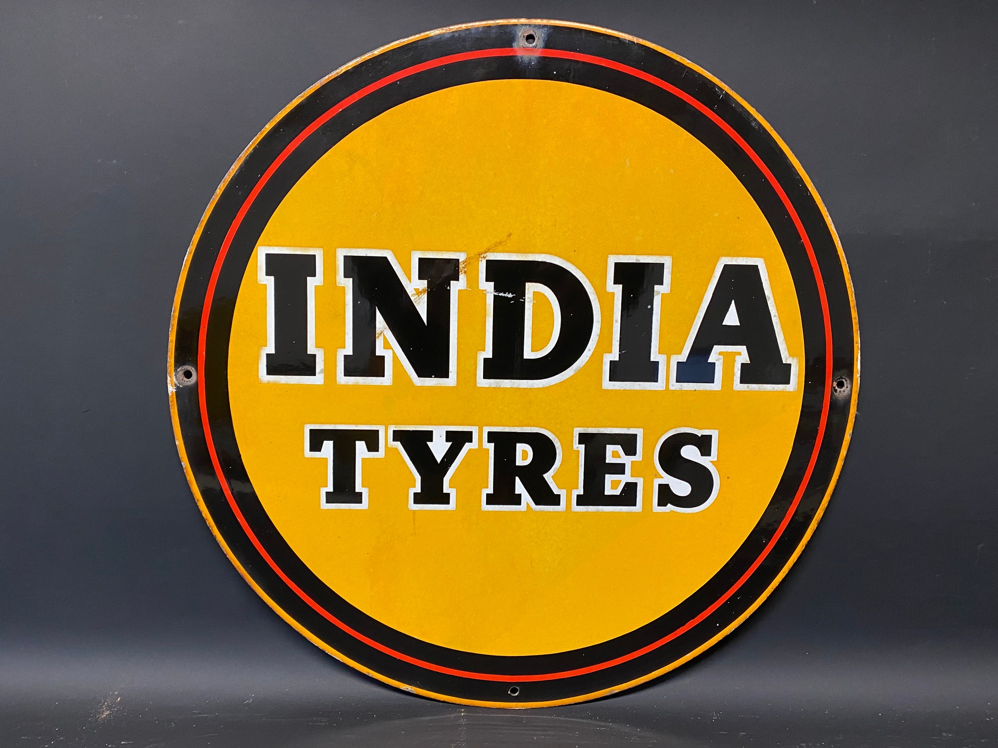 An India Tyres circular enamel sign, 18" diameter.