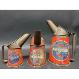 A graduated group of three Price's Motorine oil measures from quart to half pint.