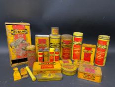 A quantity of Dunlop packaging and tins.