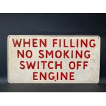 A garage forecourt pressed metal sign 'When Filling No Smoking...', 23 x 12".