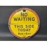 A circular No Waiting sign with hinged 'This Side Today' semi-circular attachment, 25" diameter.