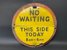 A circular No Waiting sign with hinged 'This Side Today' semi-circular attachment, 25