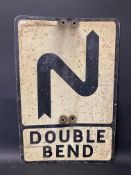 A metal road sign for Double Bend, 14 x 21".