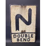 A metal road sign for Double Bend, 14 x 21".