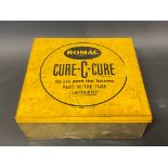A Romac Cure-C-Cure lidded counter top dispensing tin, with partial contents.