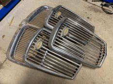 Three Wolseley grilles and another for an MG.