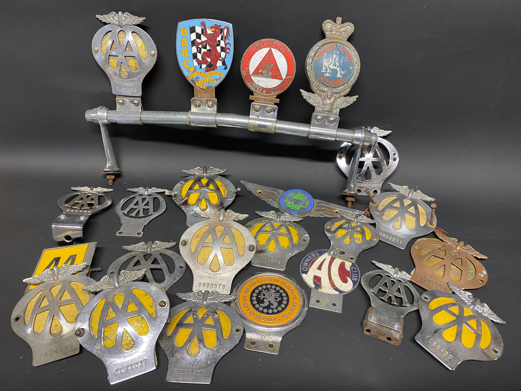 A quantity of assorted car badges including Midland Bank Motoring Club, Abbey Caravan Company etc.