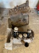 An Austin 7 crankcase and a Morris 8 engine.
