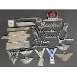 A selection of car insignia and badges including Fordson Major, Austin etc.