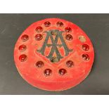 An unusual AA cast iron marker with inset red glass reflective beads.