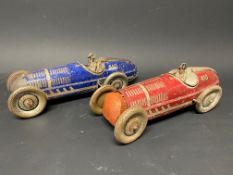 A pair of clockwork tinplate models of single seater racing cars.