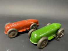 A pair of clockwork tinplate models of single seater racing cars.