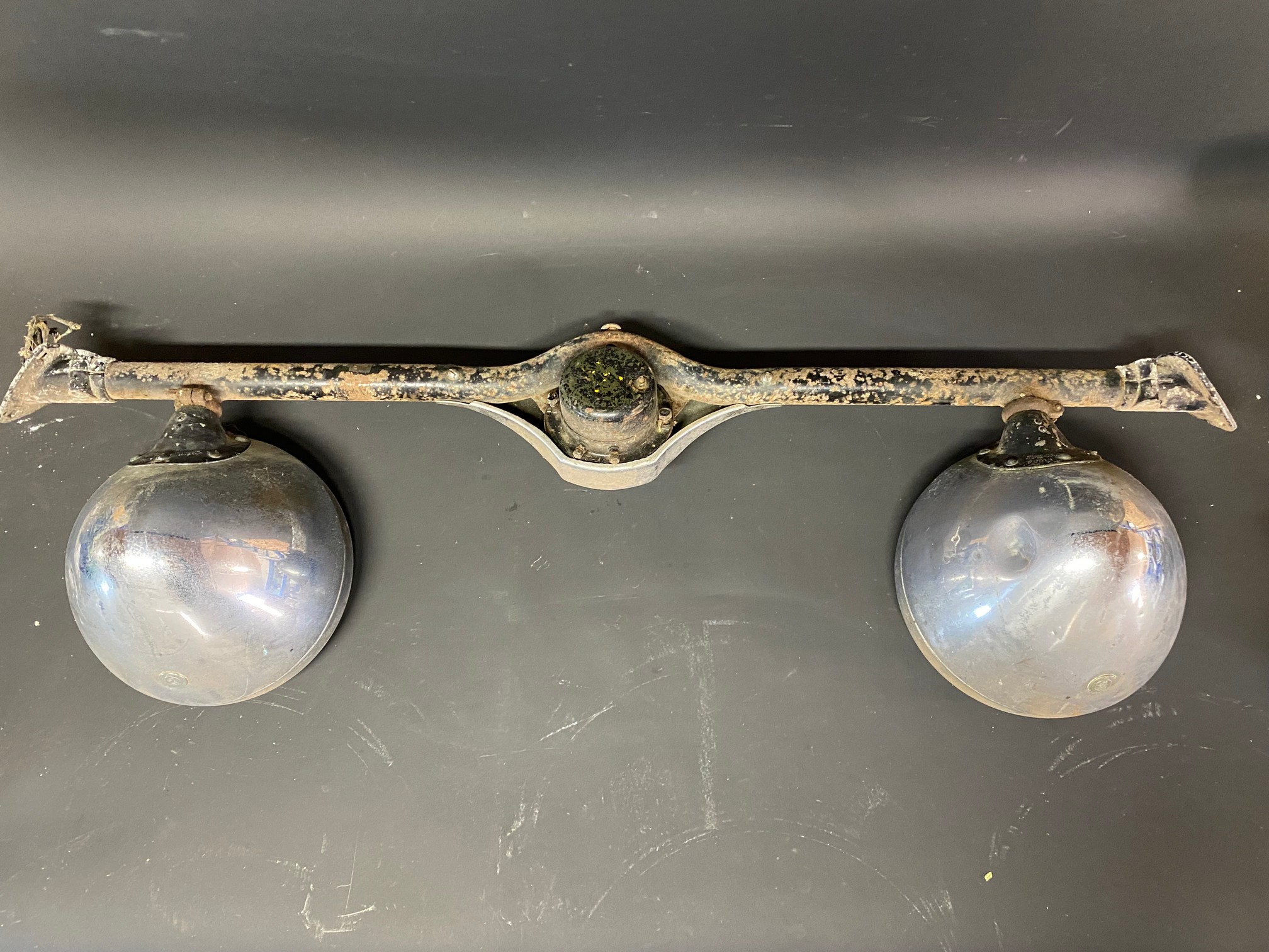 A pair of Lucas L165S headlamps on a bar that has a horn in the centre. - Image 3 of 3