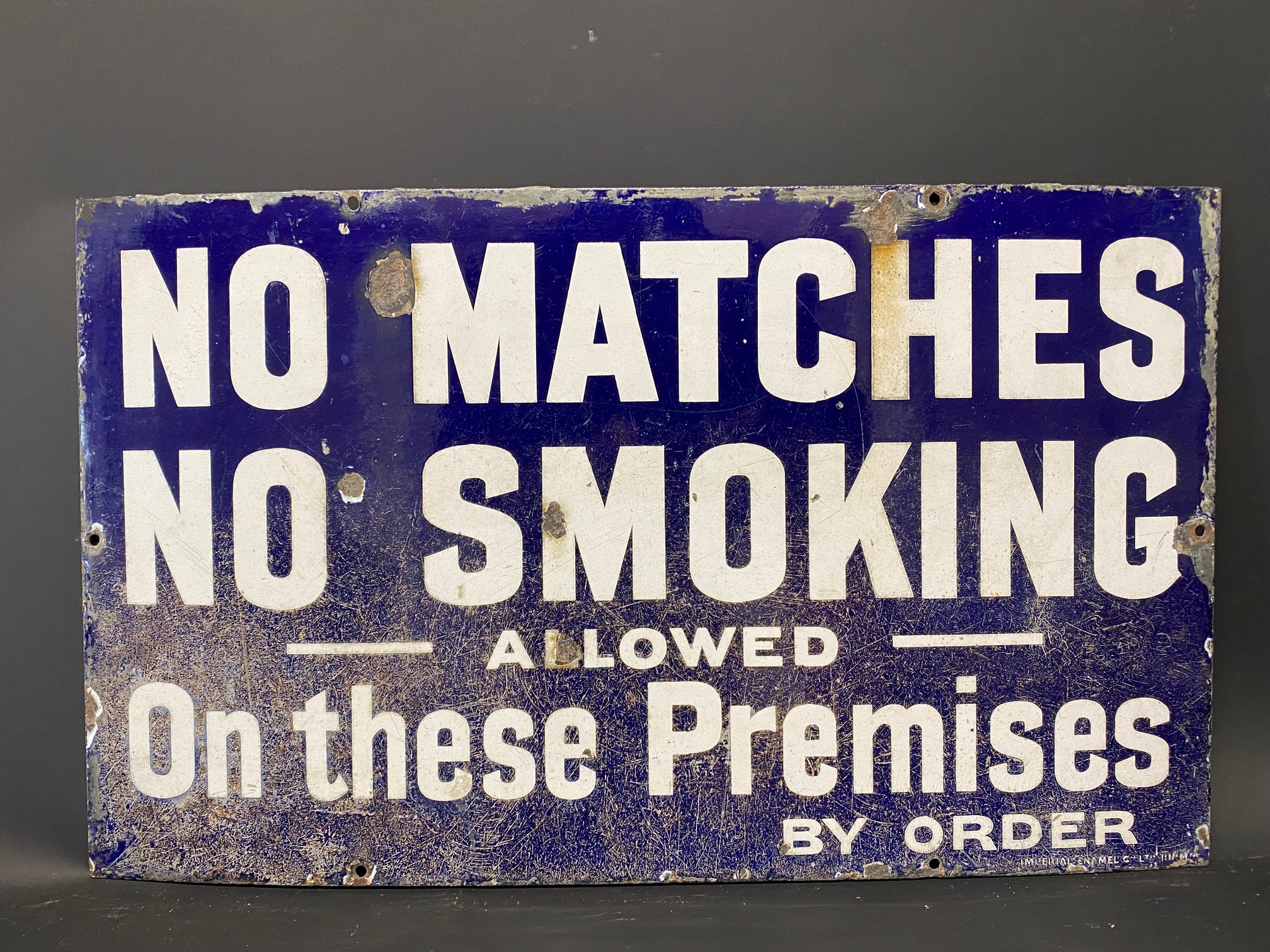 A 'No Matches No Smoking Allowed on these Premises', rectangular enamel sign by Imperial, 20 x 12".