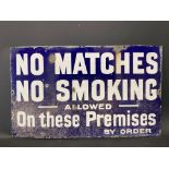 A 'No Matches No Smoking Allowed on these Premises', rectangular enamel sign by Imperial, 20 x 12".