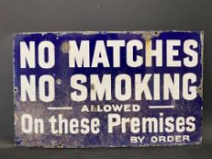 A 'No Matches No Smoking Allowed on these Premises', rectangular enamel sign by Imperial, 20 x 12".