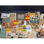 A selection of assorted motoring ephemera including early tax discs etc.