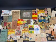 A selection of assorted motoring ephemera including early tax discs etc.