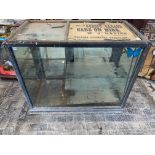 A large Edwardian mirror backed glass and wooden framed display cabinet, with two rear opening