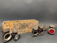 A quantity of bicycle oil and other lamps in a Dunlop box.