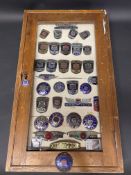 A framed group of Morris badges, assorted models.