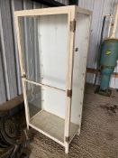 A tall metal framed front opening display cabinet, probably formerly pharmacy related, 30" w x 67" h