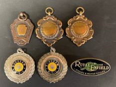 Four badges awarded to K.L.Denman including Sunbeam Motor Cycle Club, plus a Royal Enfield Cycles