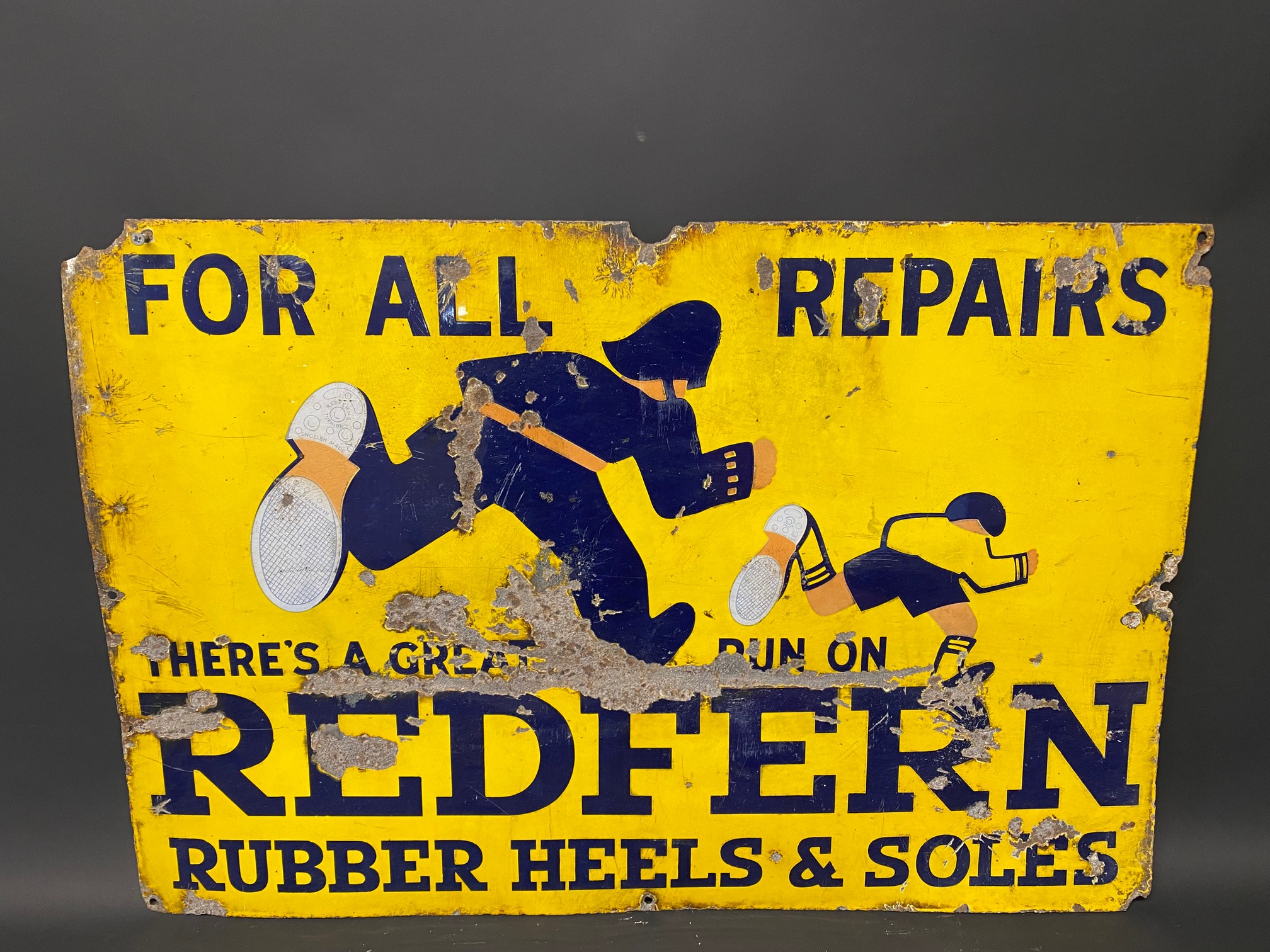 A Redfern Rubber Heels and Soles pictorial enamel sign, 30 x 20".