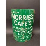 A curved post mounted enamel sign advertising Morris's Cafe's, 8 1/4 x 12".