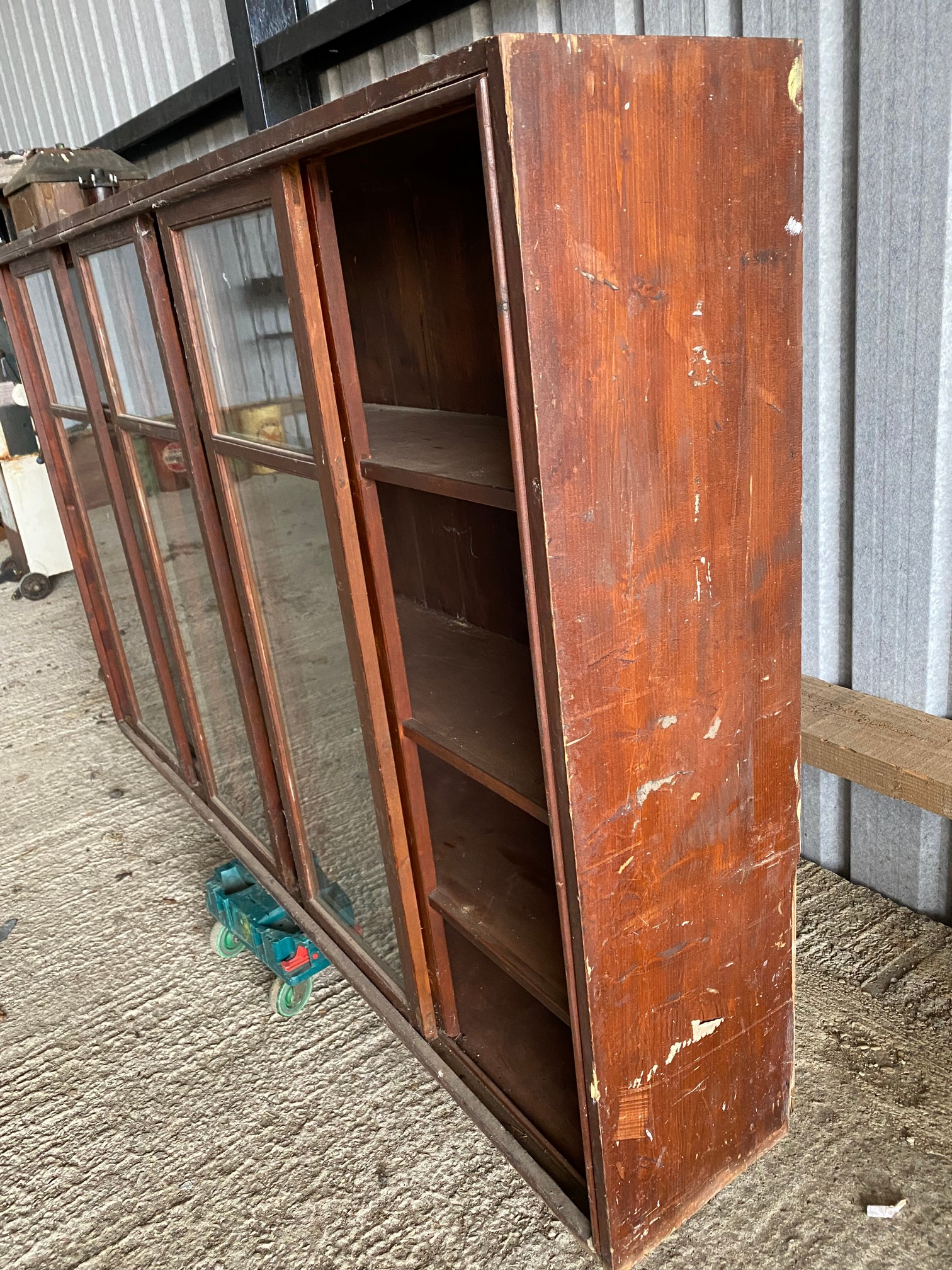 A large stained pine display cabinet with five sliding glass doors, 89 1/4" w x 54 1/2" h x 14 1/ - Image 5 of 5