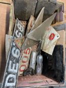 A box of assorted parts including battery covers, new old stock number plates etc.