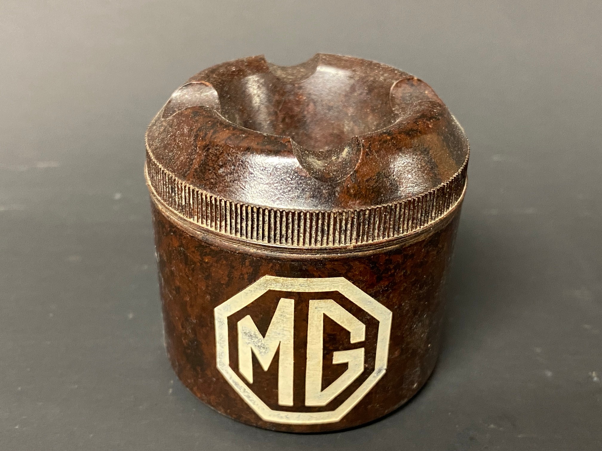 A bakelite MG branded ashtray.