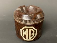 A bakelite MG branded ashtray.