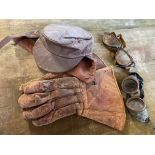 A leather motoring hat, gauntlets, goggles etc.