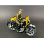 A small die-cast model of an AA motorcycle combination with rider, marked Made in England.