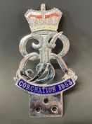 A 1953 Coronation chrome plated and enamel car badge in good condition.