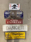 Five assorted advertising signs including an enamel sign bearing skull and crossbones, GWR etc.