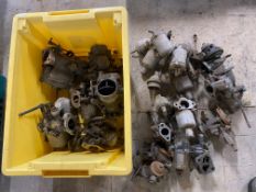 A box of assorted carburettors.