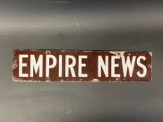 A small Empire News enamel sign, 18 x 4".