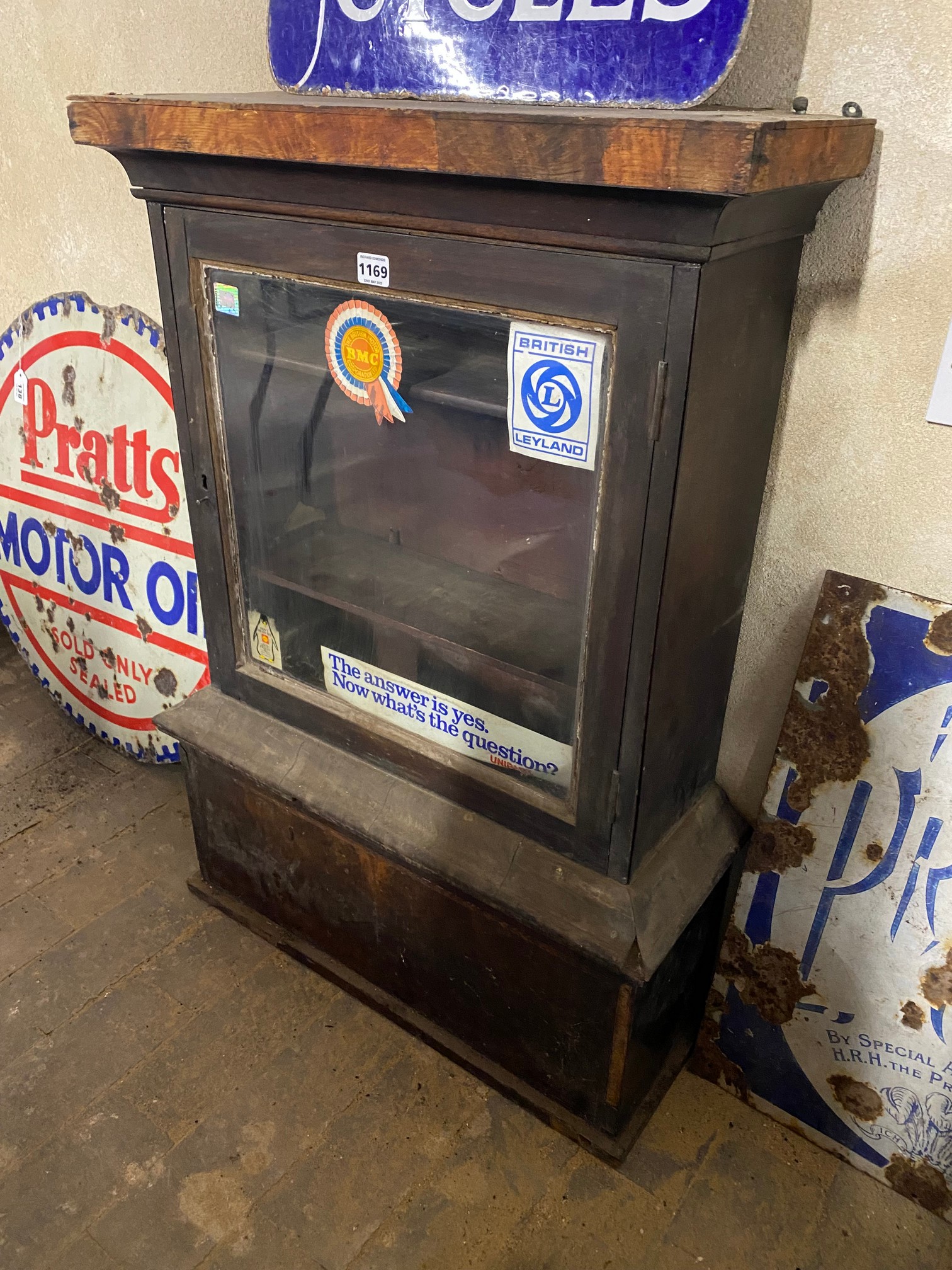 A mahogany counter top display cabinet, as removed from a garage, 24 3/4" w x 35" h x 9 1/2" d.