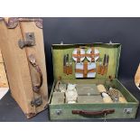 A cased picnic set and a suitcase.